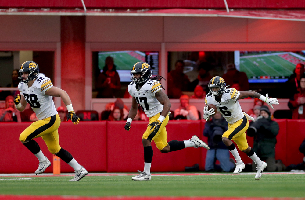 Iowa Hawkeyes wide receiver Ihmir Smith-Marsette (6) returns a kickoff for a touchdown against the Nebraska Cornhuskers Friday, November 29, 2019 at Memorial Stadium in Lincoln, Neb. (Brian Ray/hawkeyesports.com)