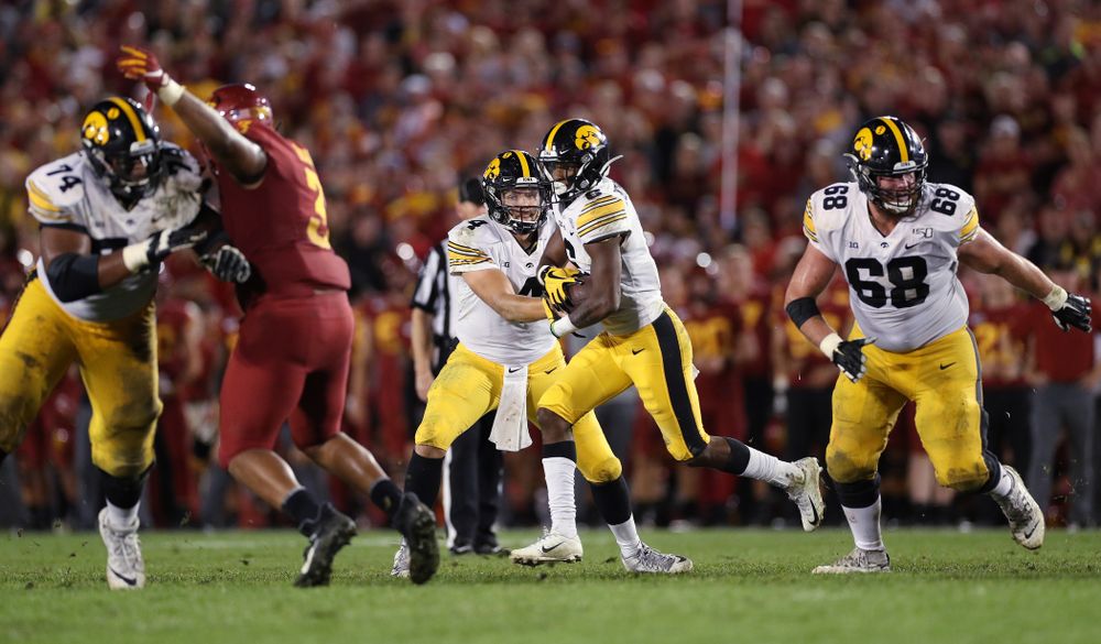 Iowa Hawkeyes wide receiver Ihmir Smith-Marsette (6) takes a handoff from quarterback Nate Stanley (4) against the Iowa State Cyclones Saturday, September 14, 2019 in Ames, Iowa. (Brian Ray/hawkeyesports.com)
