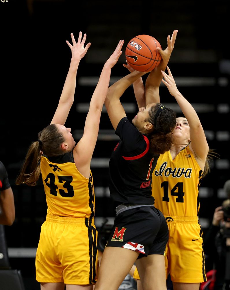 Iowa Hawkeyes forward Amanda Ollinger (43) blocks a shot against the Maryland Terrapins Thursday, January 9, 2020 at Carver-Hawkeye Arena. (Brian Ray/hawkeyesports.com)