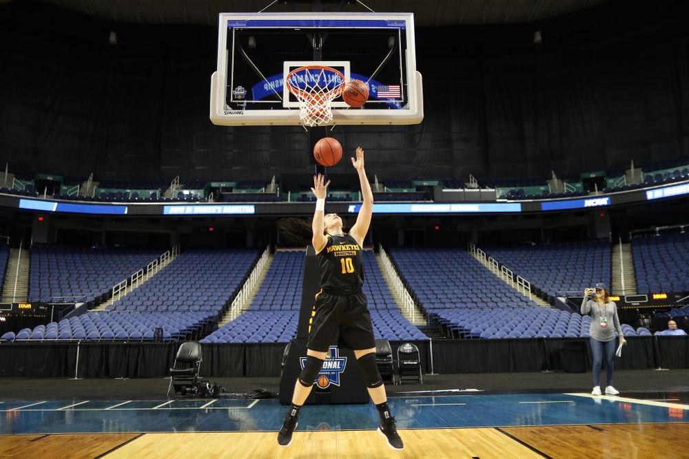 Iowa Hawkeyes forward Megan Gustafson (10) does the reverse Mikan Drill the ESPN Crew following practice for their Sweet 16 matchup against NC State Friday, March 29, 2019 at the Greensboro Coliseum in Greensboro, NC.(Brian Ray/hawkeyesports.com)