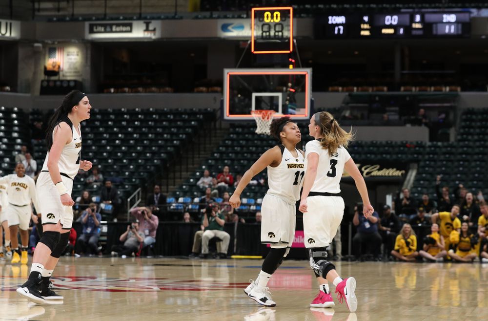 Iowa Hawkeyes guard Makenzie Meyer (3), guard Tania Davis (11), and forward Megan Gustafson (10) against the Indiana Hoosiers in the quarterfinals of the Big Ten Tournament Friday, March 8, 2019 at Bankers Life Fieldhouse in Indianapolis, Ind. (Brian Ray/hawkeyesports.com)
