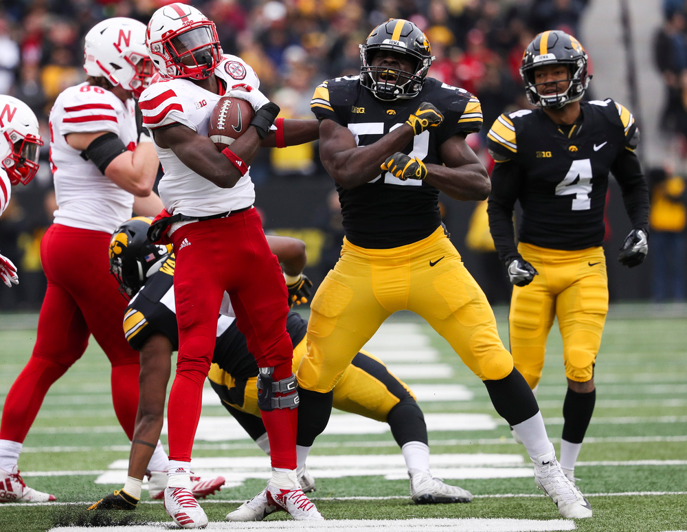 Iowa Hawkeyes linebacker Amani Jones (52) reacts after making a tackle on a kickoff during a game against Nebraska at Kinnick Stadium on November 23, 2018. (Tork Mason/hawkeyesports.com)