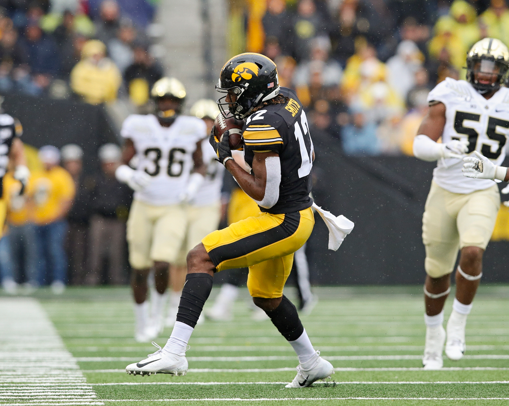 Iowa Hawkeyes wide receiver Brandon Smith (12) pulls in a pass during the third quarter of their game at Kinnick Stadium in Iowa City on Saturday, Oct 19, 2019. (Stephen Mally/hawkeyesports.com)