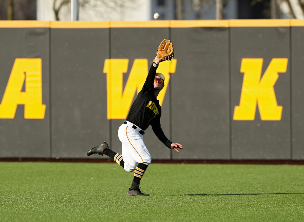 Iowa outfielder Justin Jenkins (6) makes a running catch for an out during the fourth inning of their college baseball game at Duane Banks Field in Iowa City on Tuesday, March 10, 2020. (Stephen Mally/hawkeyesports.com)