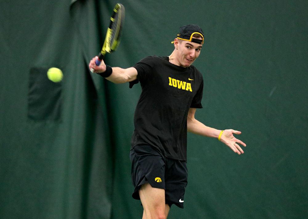 Iowa’s Nikita Snezhko returns a shot during his singles match at the Hawkeye Tennis and Recreation Complex in Iowa City on Friday, February 14, 2020. (Stephen Mally/hawkeyesports.com)