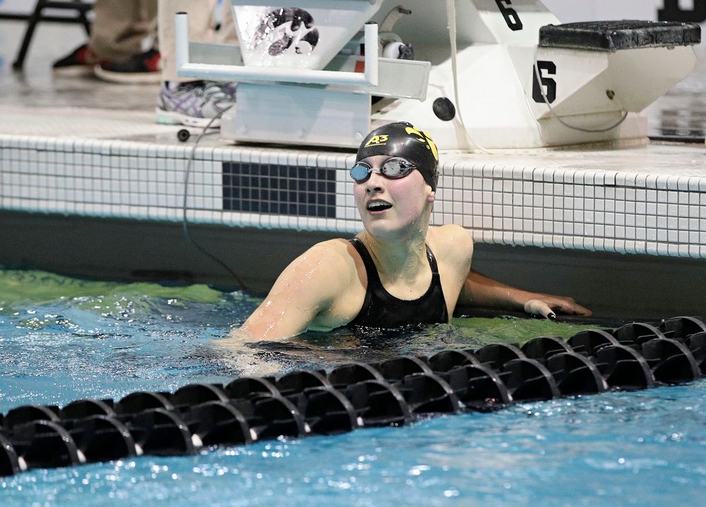 Iowa’s Hannah Burvill reacts as she looks at the video board after swimming the women’s 200 yard freestyle final event during the 2020 Women’s Big Ten Swimming and Diving Championships at the Campus Recreation and Wellness Center in Iowa City on Friday, February 21, 2020. (Stephen Mally/hawkeyesports.com)