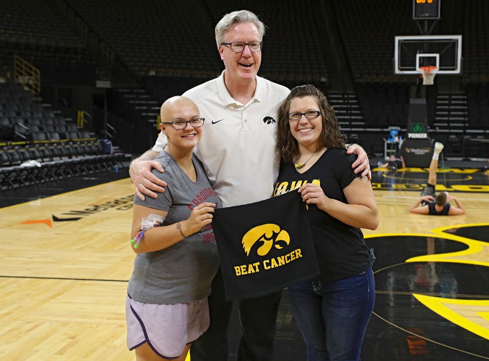 Iowa Hawkeyes head coach Fran McCaffery takes pictures with visitors from the University of Iowa Hospitals and Clinics Adolescent and Young Adult (AYA) Cancer Program after practice at Carver-Hawkeye Arena in Iowa City on Monday, Sep 30, 2019. (Stephen Mally/hawkeyesports.com)