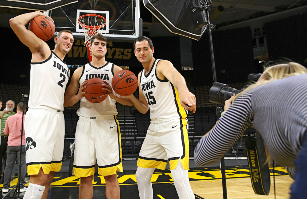 Iowa Hawkeyes forward Jack Nunge (2), forward Luka Garza (55), and forward Ryan Kriener (15) pose for a photo during Iowa Men’s Basketball Media Day at Carver-Hawkeye Arena in Iowa City on Wednesday, Oct 9, 2019. (Stephen Mally/hawkeyesports.com)