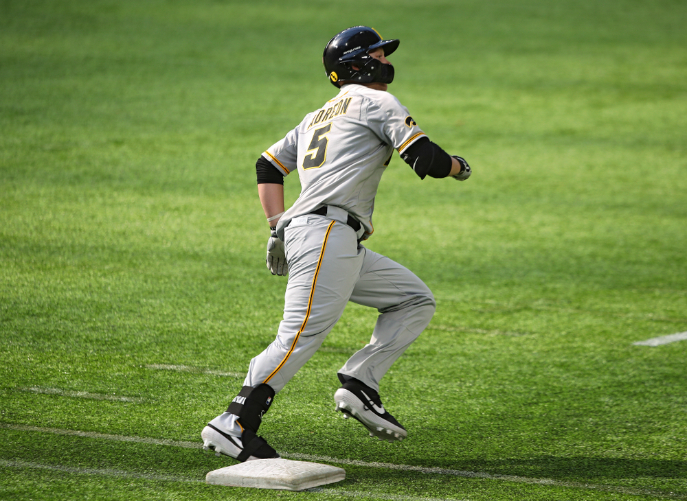 Iowa Hawkeyes outfielder Zeb Adreon (5) hits a double during the ninth inning of their CambriaCollegeClassic game at U.S. Bank Stadium in Minneapolis, Minn. on Friday, February 28, 2020. (Stephen Mally/hawkeyesports.com)