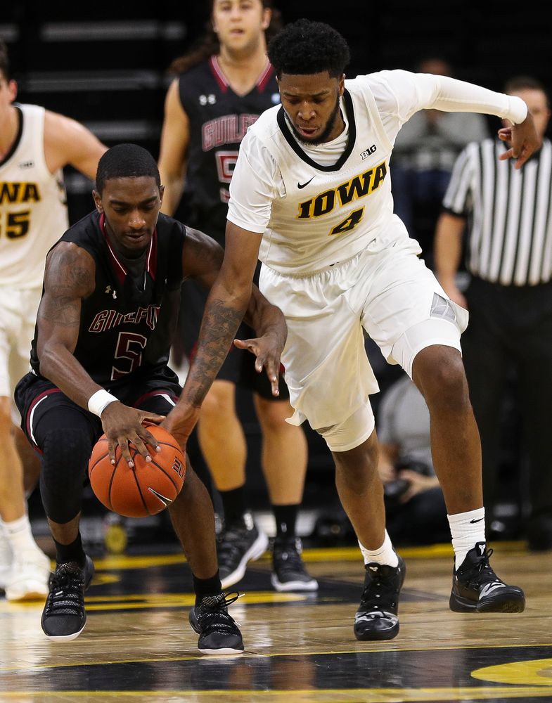 Iowa Hawkeyes guard Isaiah Moss (4) steals the ball during a game against Guilford College at Carver-Hawkeye Arena on November 4, 2018. (Tork Mason/hawkeyesports.com)