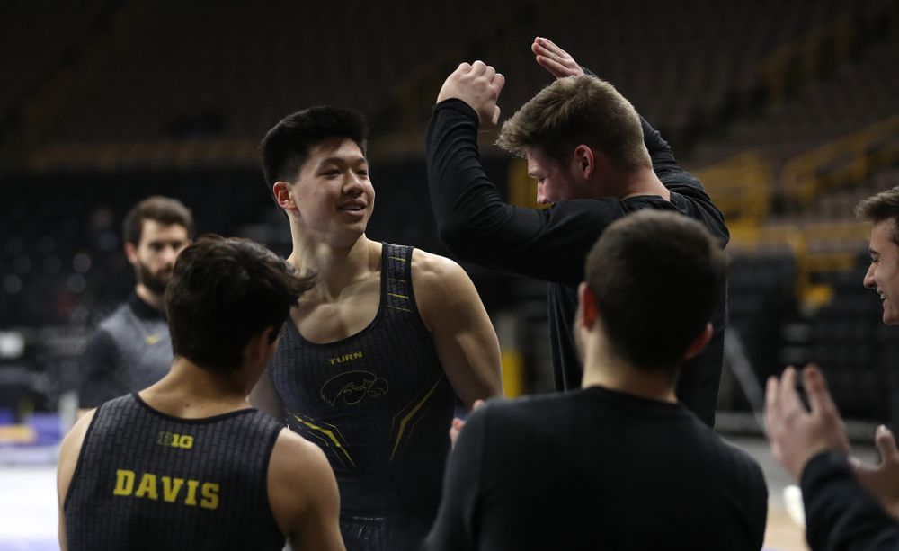 Iowa's Bennet Huang competes on the high bar against the Ohio State Buckeyes Saturday, March 16, 2019 at Carver-Hawkeye Arena. (Brian Ray/hawkeyesports.com)