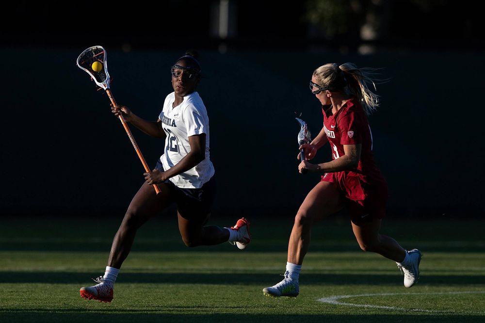 STANFORD, California - FEBRUARY 14: Virginia Cavaliers defense Jalen Knight (12) runs past Stanford Cardinal attack Ali Baiocco (13) during the second half at Cagan Stadium on February 14, 2020 in Stanford, California. The Virginia Cavaliers defeated the Stanford Cardinal 12-11. (Photo by Jason O. Watson)