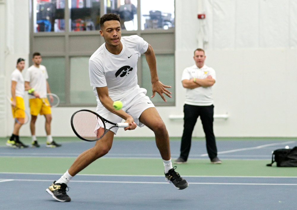 Iowa’s Oliver Okonkwo returns a shot during his doubles match at the Hawkeye Tennis and Recreation Complex in Iowa City on Sunday, February 16, 2020. (Stephen Mally/hawkeyesports.com)