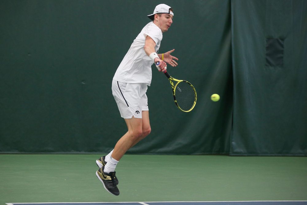 Iowa’s Nikita Snezhko returns a hit during the Iowa men’s tennis meet vs Nebraska on Sunday, March 1, 2020 at the Hawkeye Tennis and Recreation Complex. (Lily Smith/hawkeyesports.com)