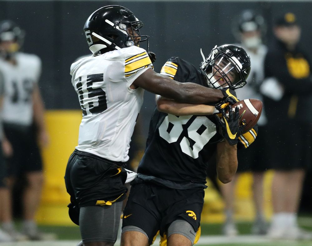 Iowa Hawkeyes defensive back Dallas Craddieth (15) and wide receiver Nico Ragaini (89) during Fall Camp Practice No. 16 Tuesday, August 20, 2019 at the Ronald D. and Margaret L. Kenyon Football Practice Facility. (Brian Ray/hawkeyesports.com)