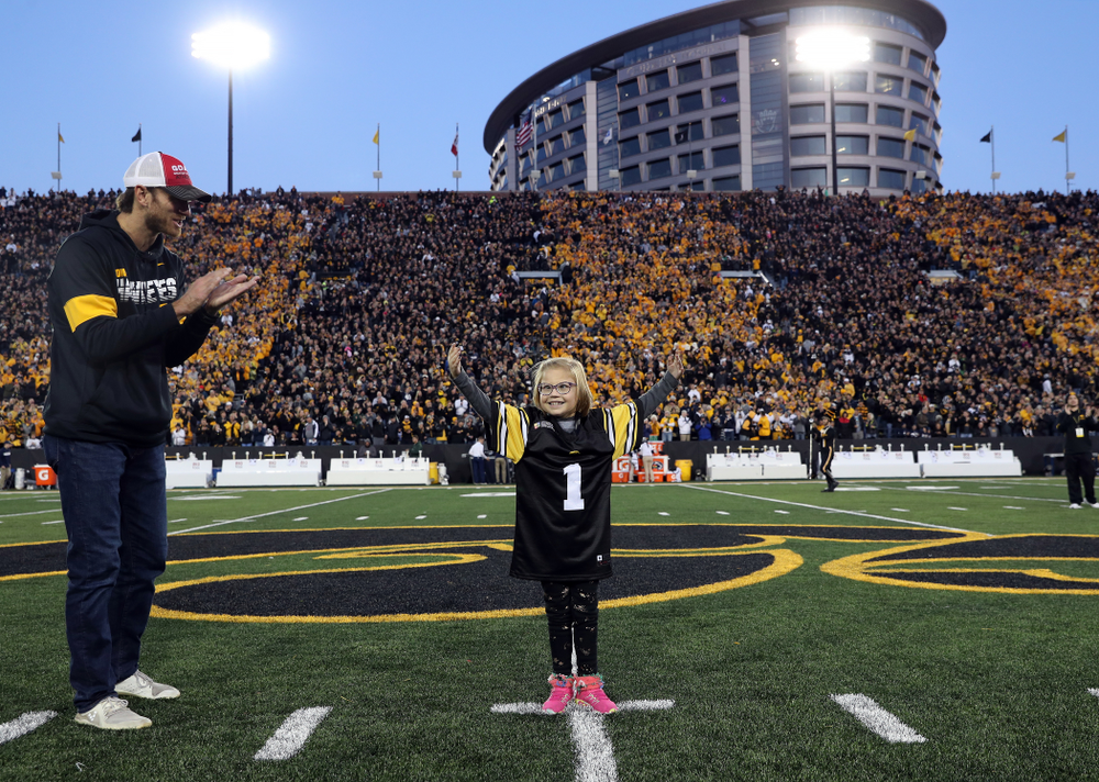 Honorary Captain Ricky Stanzi and Stead Family ChildrenÕs Hospital Kid Captain Gabby Yoder before the Iowa Hawkeyes game against the Penn State Nittany Lions Saturday, October 12, 2019 at Kinnick Stadium. (Brian Ray/hawkeyesports.com)