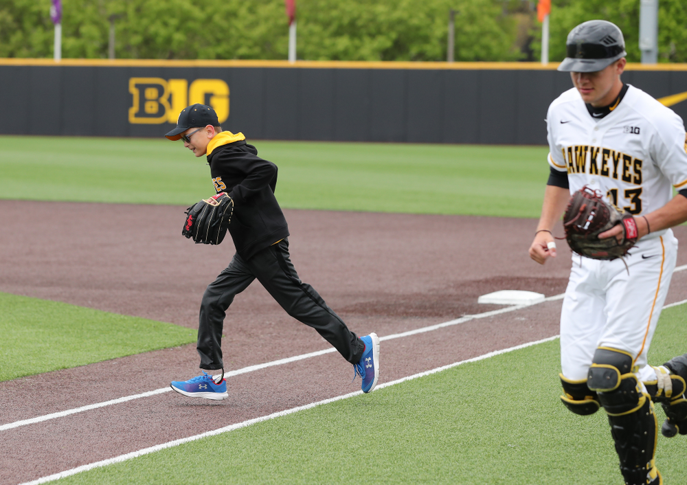 Garret Nichols throws out a first pitch before the Iowa Hawkeyes game against Michigan State Sunday, May 12, 2019 at Duane Banks Field. (Brian Ray/hawkeyesports.com)