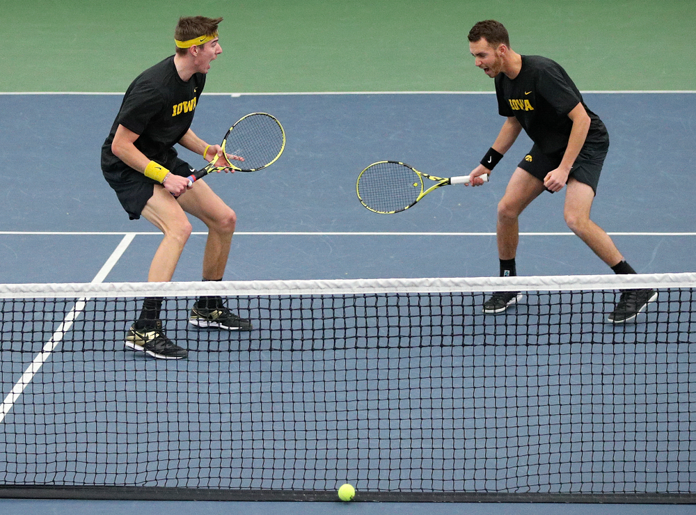 Iowa’s Nikita Snezhko (from left) and Kareem Allaf celebrate a point during their doubles match against Marquette at the Hawkeye Tennis and Recreation Complex in Iowa City on Saturday, January 25, 2020. (Stephen Mally/hawkeyesports.com)