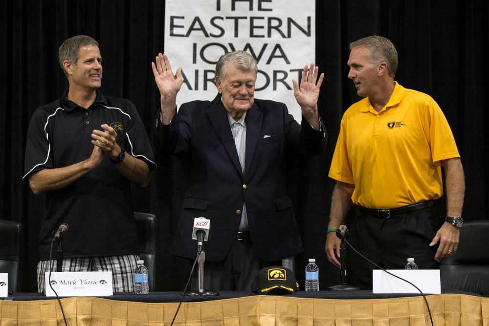 Former Hawkeye Football Head Coach Hayden Fry waves to the crowd at the start of a panel discussion with former quarterback Chuck Long during a panel discussion at Fry Fest Friday, Aug. 29, 2014 in Coralville. (Brian Ray/hawkeyesports.com)