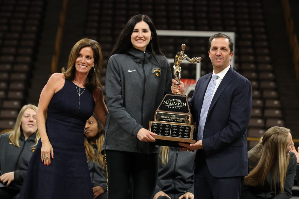 Iowa Hawkeyes forward Megan Gustafson (10) is presented with the Naismith Player Of The Year Trophy during the teamÕs Celebr-Eight event Wednesday, April 24, 2019 at Carver-Hawkeye Arena. (Brian Ray/hawkeyesports.com)