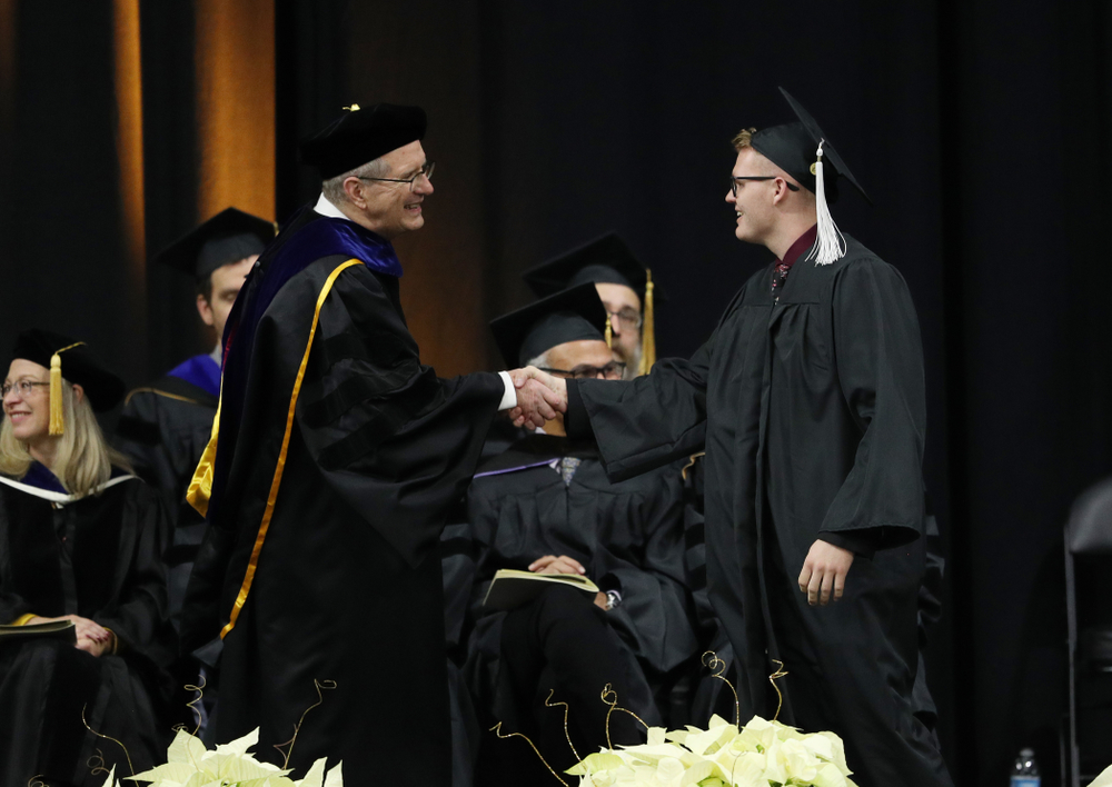 Iowa Men's Basketball manager Lucas Pauley during the Fall Commencement Ceremony Saturday, December 15, 2018 at Carver-Hawkeye Arena. (Brian Ray/hawkeyesports.com)