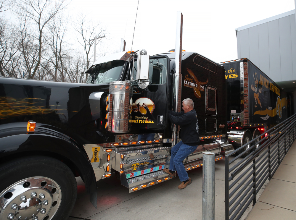 TanTara Transportation Corporation President Mike Riggan climbs into Hawk One before departing for Tampa, Florida Friday, December 21, 2018 at the Hansen Football Performance Center. (Brian Ray/hawkeyesports.com)