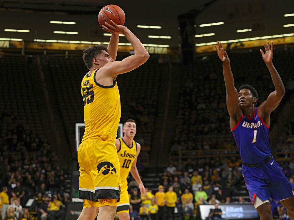 Iowa Hawkeyes center Luka Garza (55) makes a basket during the second half of their game at Carver-Hawkeye Arena in Iowa City on Monday, Nov 11, 2019. (Stephen Mally/hawkeyesports.com)
