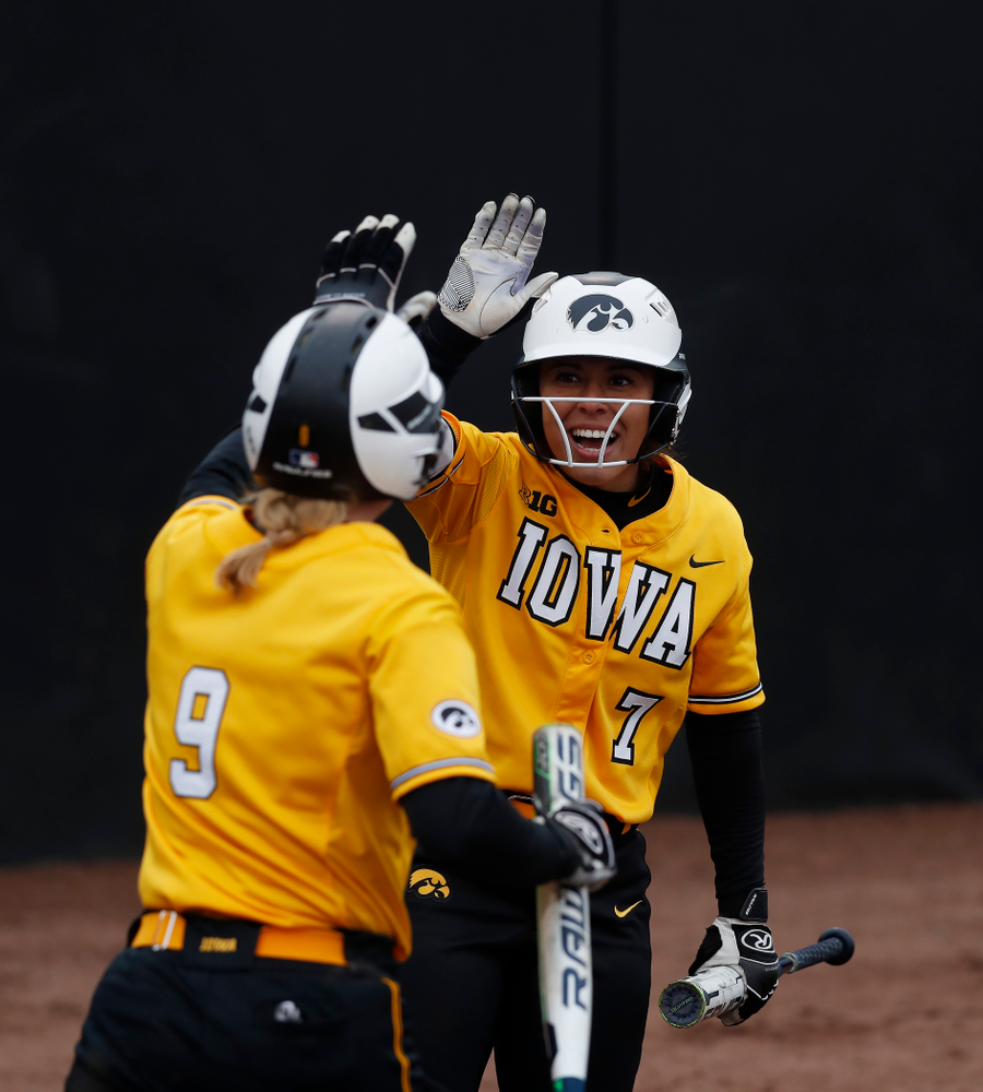 Iowa Hawkeyes infielder Lea Thompson (7) and infielder Sarah Kurtz (9) against UW Green Bay Tuesday, March 27, 2018 at Bob Pearl Field. (Brian Ray/hawkeyesports.com)