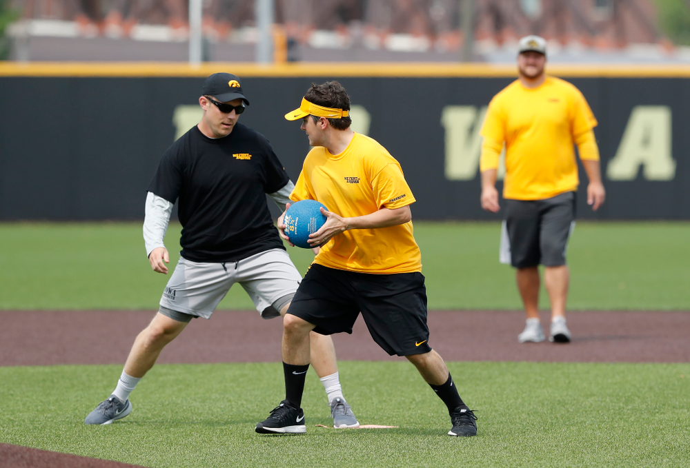 Asst. Director Compliance Henry Archuleta and director of Football New Media Max Allen during the Iowa Student Athlete Kickoff Kickball game Sunday, August 19, 2018 at Duane Banks Field. (Brian Ray/hawkeyesports.com)