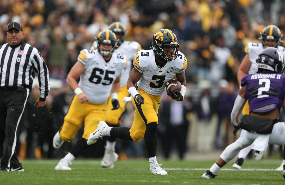 Iowa Hawkeyes wide receiver Tyrone Tracy Jr. (3) carries the ball on his way to a touchdown against the Northwestern Wildcats Saturday, October 26, 2019 at Ryan Field in Evanston, Ill. (Brian Ray/hawkeyesports.com)