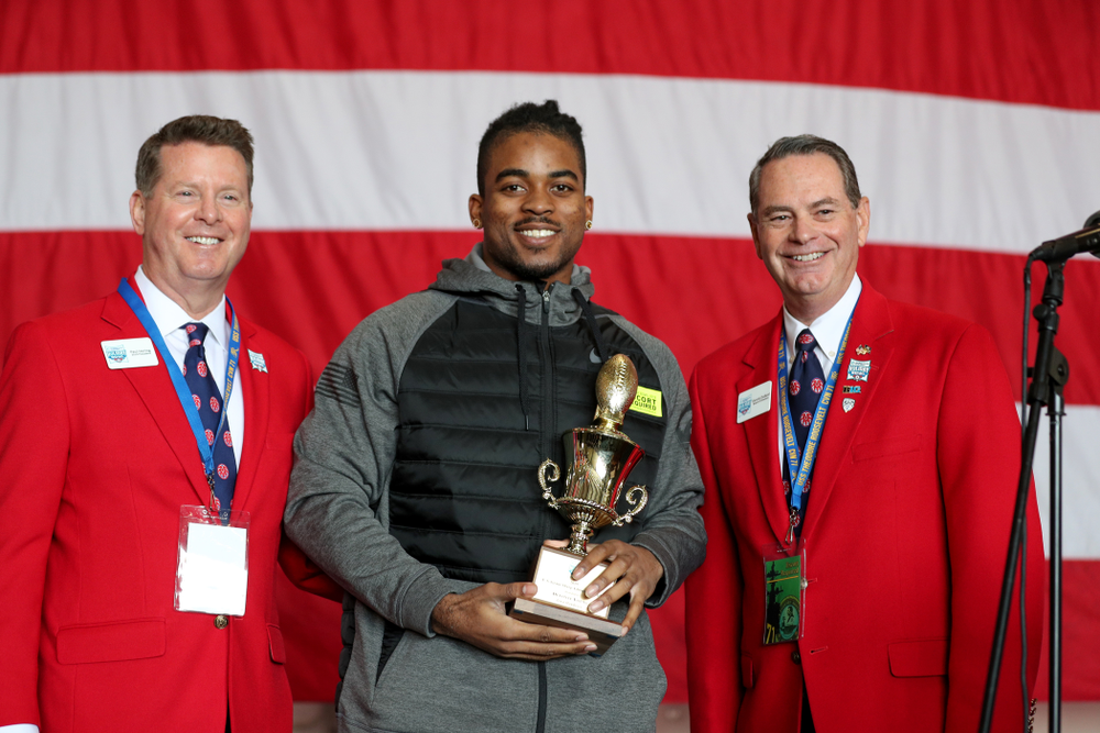 Iowa Hawkeyes defensive back Devonte Young (17) revives the U.S. Grant Sharp AdmiralÕs Trophy during tour of the USS Theodore Roosevelt (CVN-71) Tuesday, December 24, 2019 at the Naval Base Coronado. (Brian Ray/hawkeyesports.com)