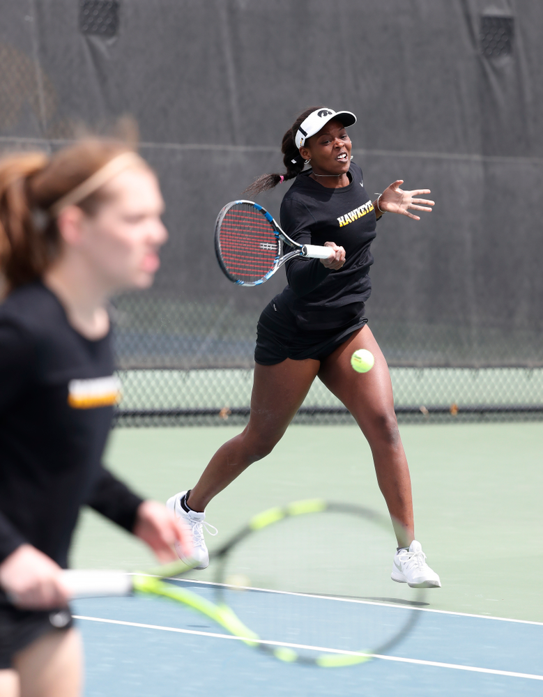 Adorabol Huckleby and Zoe Douglas play a doubles match against the Wisconsin Badgers Sunday, April 22, 2018 at the Hawkeye Tennis and Recreation Center. (Brian Ray/hawkeyesports.com)