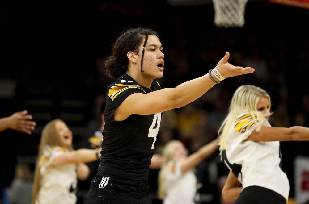 Members of the Hawkeye Football team performs with the Iowa Dance Team at halftime of the Iowa Hawkeyes game against the Ohio State Buckeyes Thursday, February 20, 2020 at Carver-Hawkeye Arena. (Brian Ray/hawkeyesports.com)
