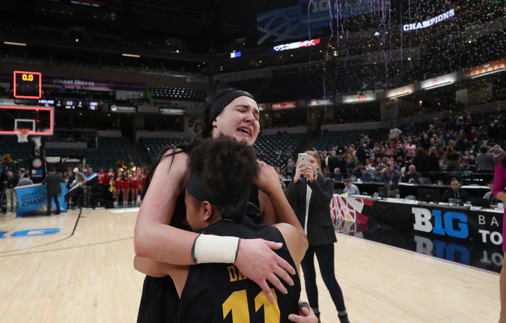 Iowa Hawkeyes forward Megan Gustafson (10) hugs guard Tania Davis (11) following their win against the Maryland Terrapins Sunday, March 10, 2019 at Bankers Life Fieldhouse in Indianapolis, Ind. (Brian Ray/hawkeyesports.com)