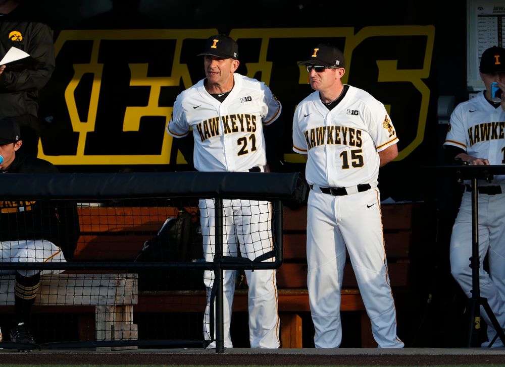 Iowa Hawkeyes head coach Rick Heller and associate head coach Marty Sutherland against the Michigan Wolverines Friday, April 27, 2018 at Duane Banks Field in Iowa City. (Brian Ray/hawkeyesports.com)
