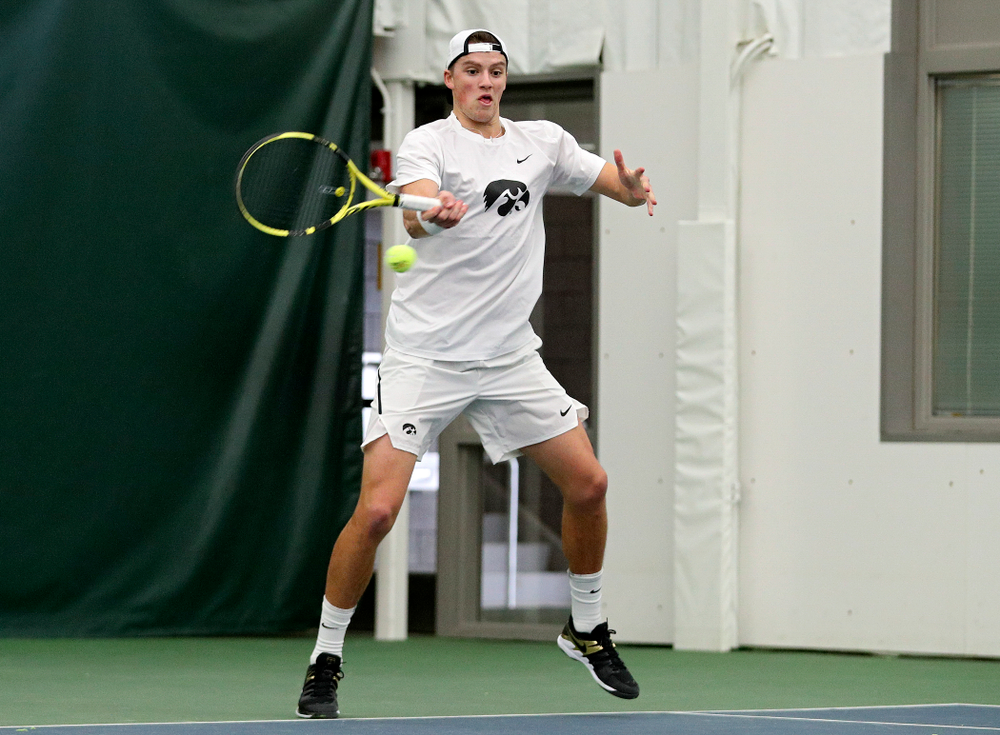 Iowa’s Joe Tyler returns a shot during his doubles match at the Hawkeye Tennis and Recreation Complex in Iowa City on Sunday, February 16, 2020. (Stephen Mally/hawkeyesports.com)