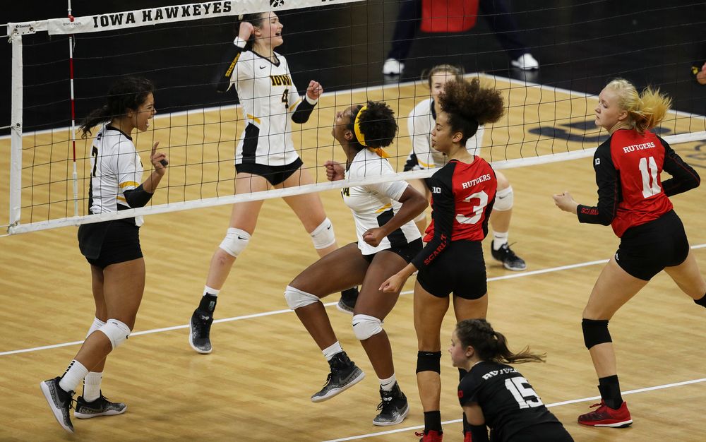 Iowa Hawkeyes setter Brie Orr (7) and Iowa Hawkeyes middle blocker Amiya Jones (9) celebrate after winning match point during a match against Rutgers at Carver-Hawkeye Arena on November 2, 2018. (Tork Mason/hawkeyesports.com)