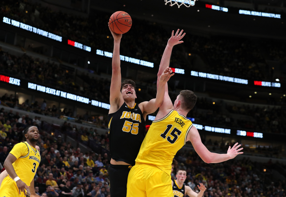 Iowa Hawkeyes forward Luka Garza (55) against the Michigan Wolverines in the 2019 Big Ten Men's Basketball Tournament Friday, March 15, 2019 at the United Center in Chicago. (Brian Ray/hawkeyesports.com)