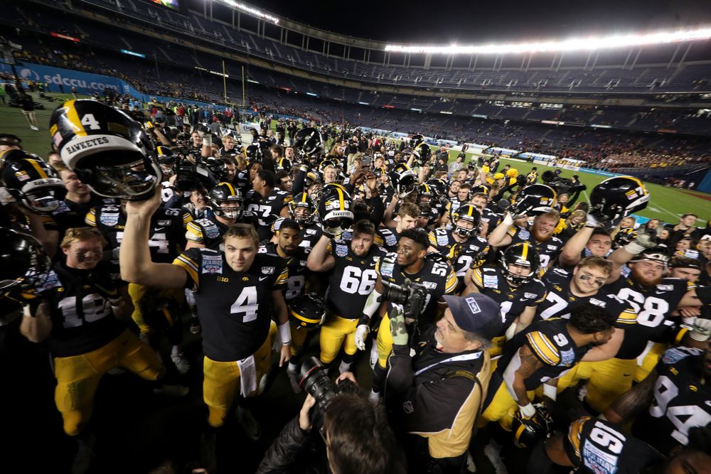 The Iowa Hawkeyes sing the Fight Song after their win against USC in the Holiday Bowl Friday, December 27, 2019 at San Diego Community Credit Union Stadium. (Brian Ray/hawkeyesports.com)