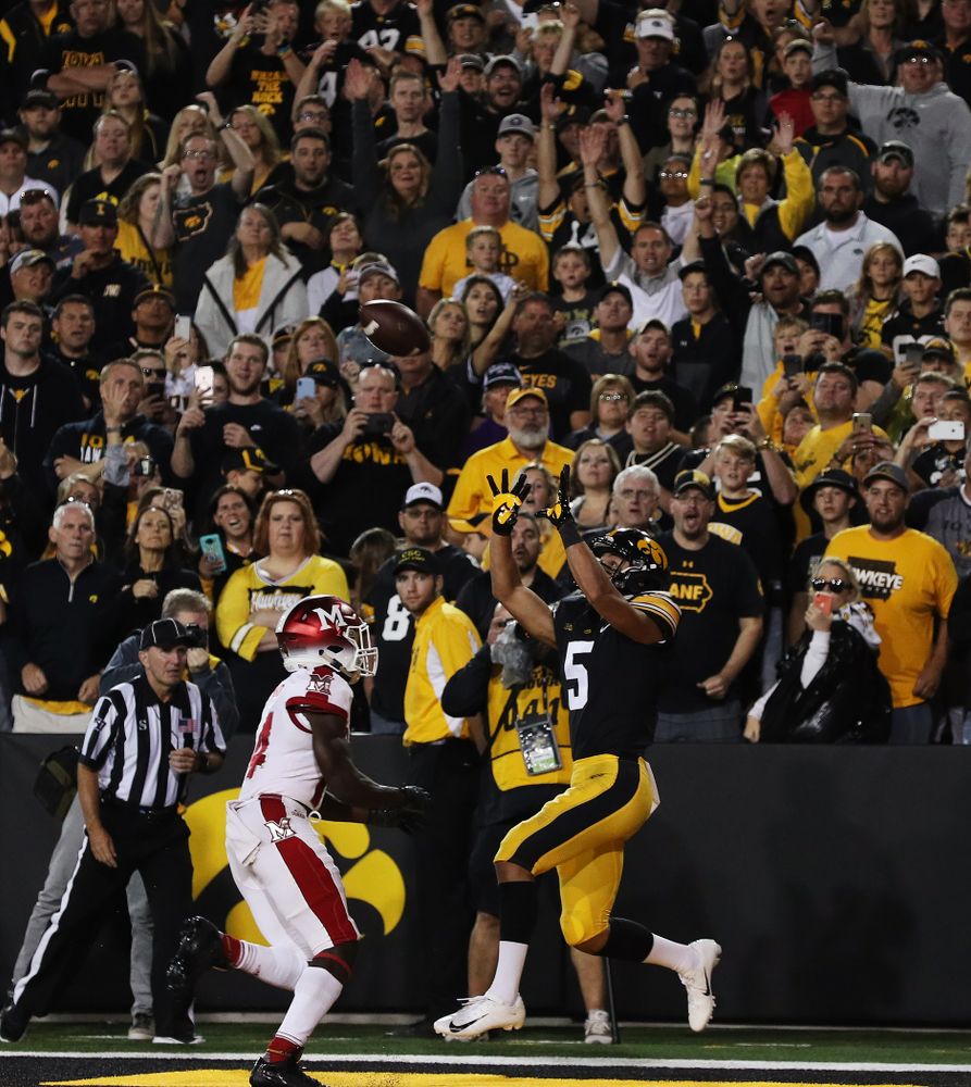 Iowa Hawkeyes wide receiver Oliver Martin (5) hauls in a touchdown pass against the Miami RedHawks Saturday, August 31, 2019 at Kinnick Stadium in Iowa City. (Brian Ray/hawkeyesports.com)