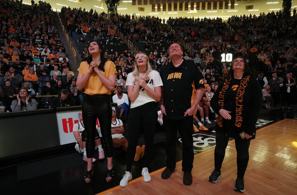 Megan Gustafson watches a video message from her teammates and coaches after her number was raised into the rafters during a jersey retirement ceremony Sunday, January 26, 2020 at Carver-Hawkeye Arena. (Brian Ray/hawkeyesports.com)