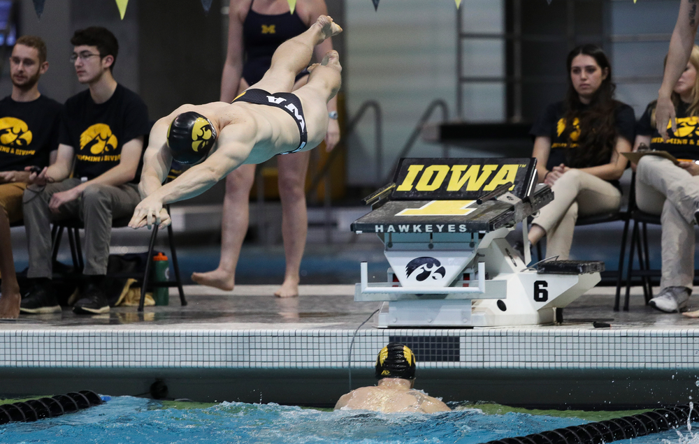 Iowa's Michal Brzus competes in the 400-yard medley relay during a meet against Michigan and Denver at the Campus Recreation and Wellness Center on November 3, 2018. (Tork Mason/hawkeyesports.com)
