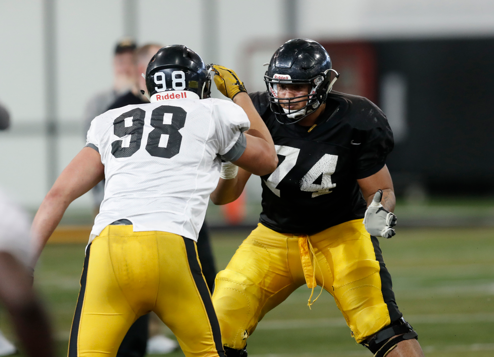 Iowa Hawkeyes offensive lineman Tristan Wirfs (74) and defensive end Anthony Nelson (98) Wednesday, April 4, 2018 at the Hansen Football Performance Center. (Brian Ray/hawkeyesports.com)