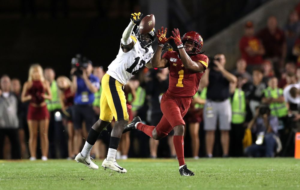 Iowa Hawkeyes defensive back D.J. Johnson (12) breaks up a pass against the Iowa State Cyclones Saturday, September 14, 2019 in Ames, Iowa. (Brian Ray/hawkeyesports.com)