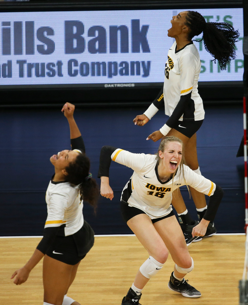 Iowa Hawkeyes middle blocker Hannah Clayton (18) and Iowa Hawkeyes outside hitter Taylor Louis (16) react after winning a point during a game against Purdue at Carver-Hawkeye Arena on October 13, 2018. (Tork Mason/hawkeyesports.com)