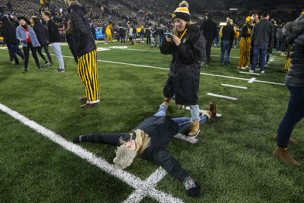 Fans take photos on the field during Iowa football vs Minnesota on Saturday, November 16, 2019 at Kinnick Stadium. (Lily Smith/hawkeyesports.com)