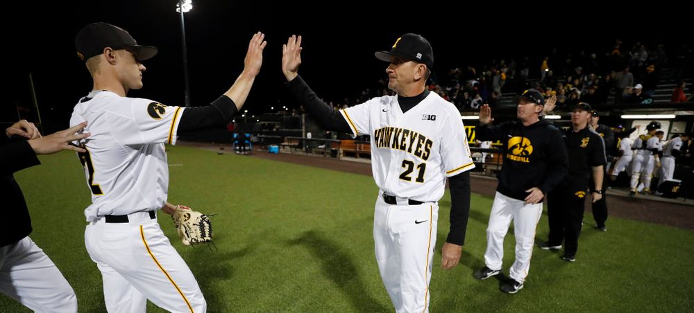 Iowa Hawkeyes pitcher Zach Daniels (2) and head coach Rick Heller against the Michigan Wolverines Friday, April 27, 2018 at Duane Banks Field in Iowa City. (Brian Ray/hawkeyesports.com)