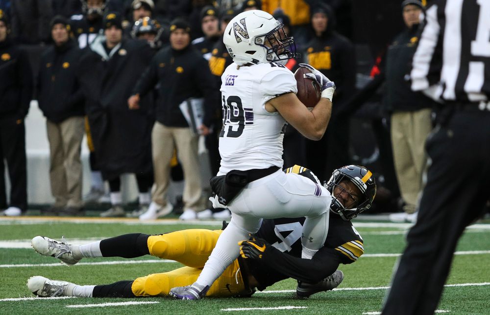 Iowa Hawkeyes defensive back Josh Turner (4) makes a tackle during a game against Northwestern at Kinnick Stadium on November 10, 2018. (Tork Mason/hawkeyesports.com)