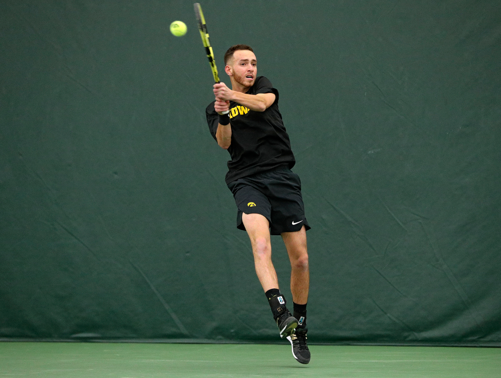 Iowa’s Kareem Allaf returns a shot during his singles match at the Hawkeye Tennis and Recreation Complex in Iowa City on Friday, February 14, 2020. (Stephen Mally/hawkeyesports.com)