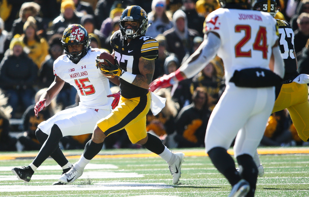 Iowa Hawkeyes defensive back Amani Hooker (27) makes an interception during a game against Maryland at Kinnick Stadium on October 20, 2018. (Tork Mason/hawkeyesports.com)